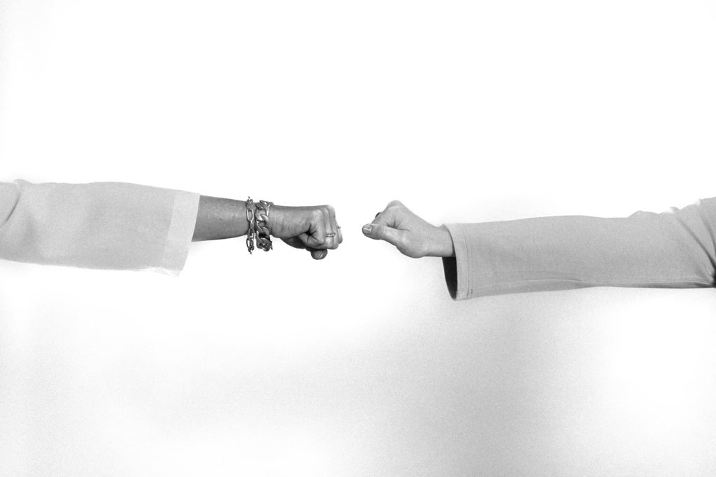 A fist bump between team members after setting intentions